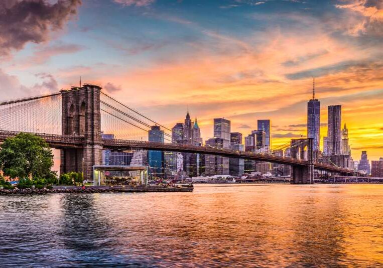 A view of the brooklyn bridge and lower manhattan.